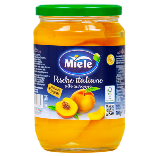 Jar of Miele Italian peach preserve on a white background